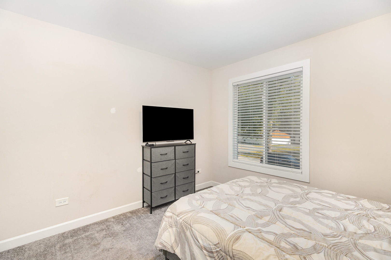 16314 Homan Avenue Markham, IL 60428 - Photo 27 of 32 a bedroom with a bed and a flat screen tv