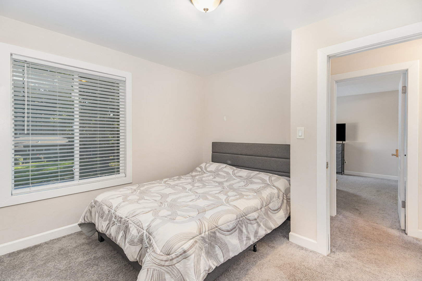 16314 Homan Avenue Markham, IL 60428 - Photo 28 of 32 a bedroom with a bed and a window