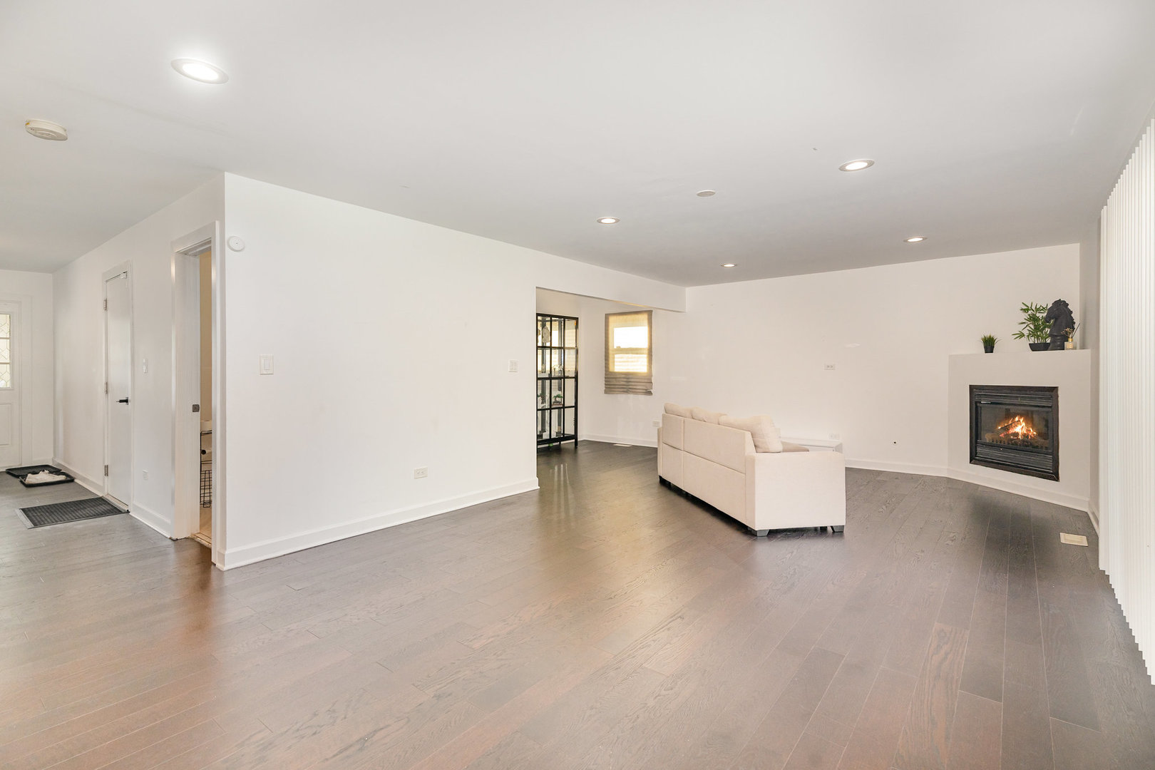16314 Homan Avenue Markham, IL 60428 - Photo 8 of 32 a view of an empty room with a fireplace