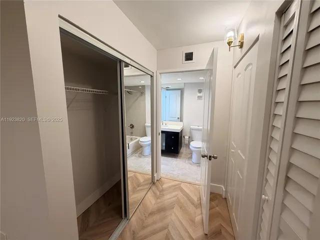 a bathroom with a shower and a sink