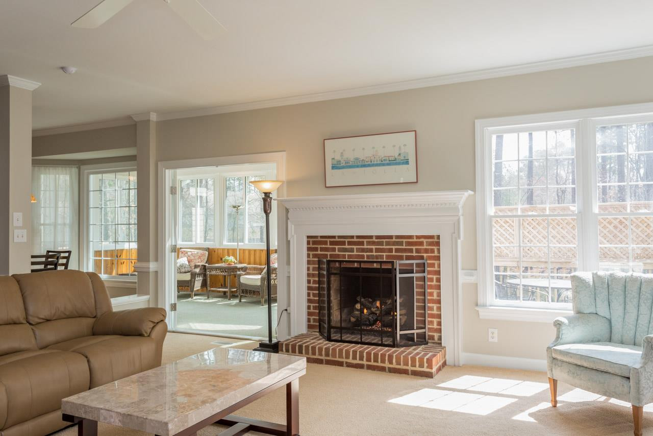 5600 Crossfield Drive Raleigh, NC 27613 - Photo 9 of 25 The family room leads to the sunroom which provides a wonderful flow for entertaining. The family room has been freshly painted with SW Agreeable Grey and features crown molding and chair railing. The Sunroom Adjoins the Family Room