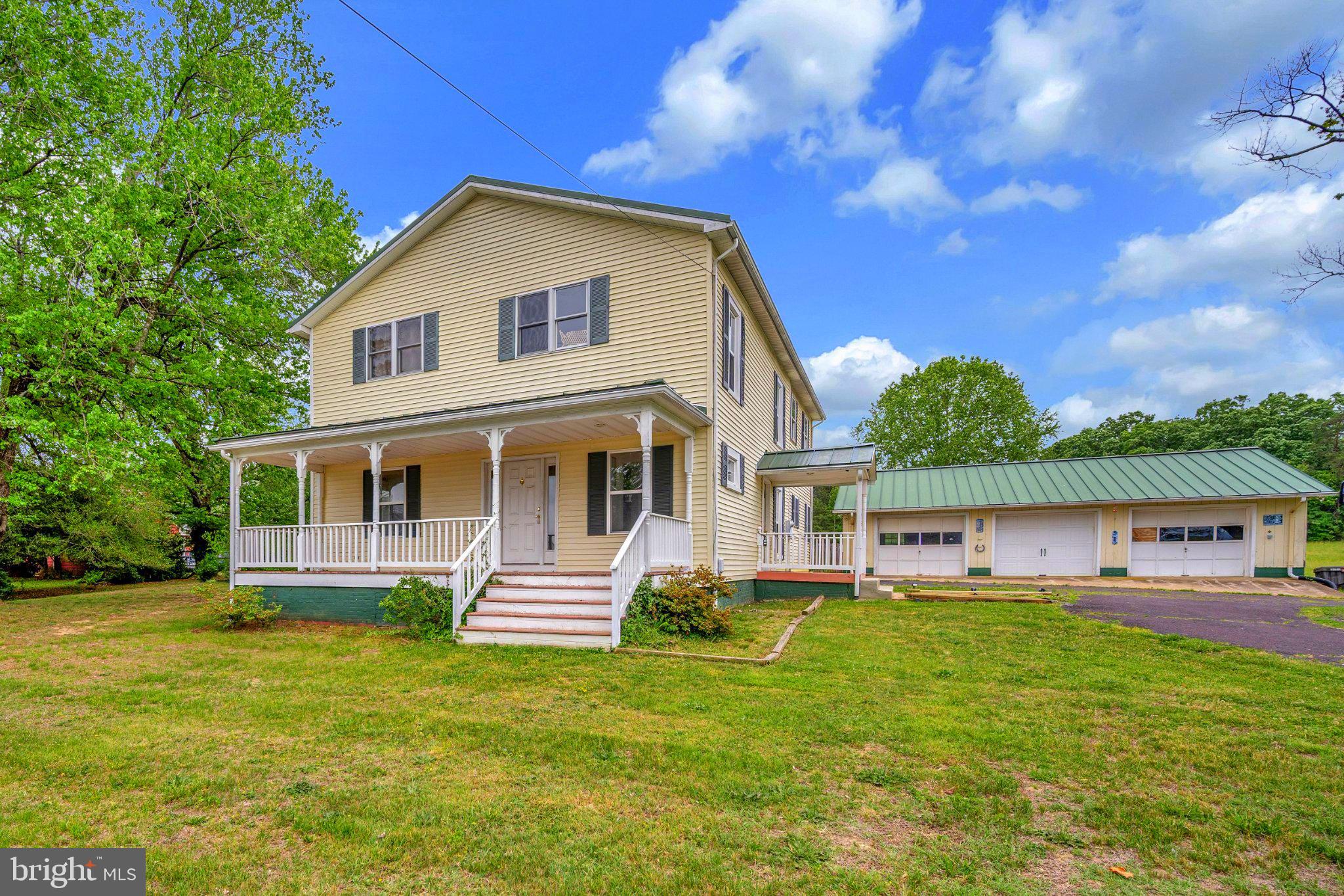23202 Village Road Unionville, VA 22567 - Photo 1 of 58 a front view of house with yard and green space