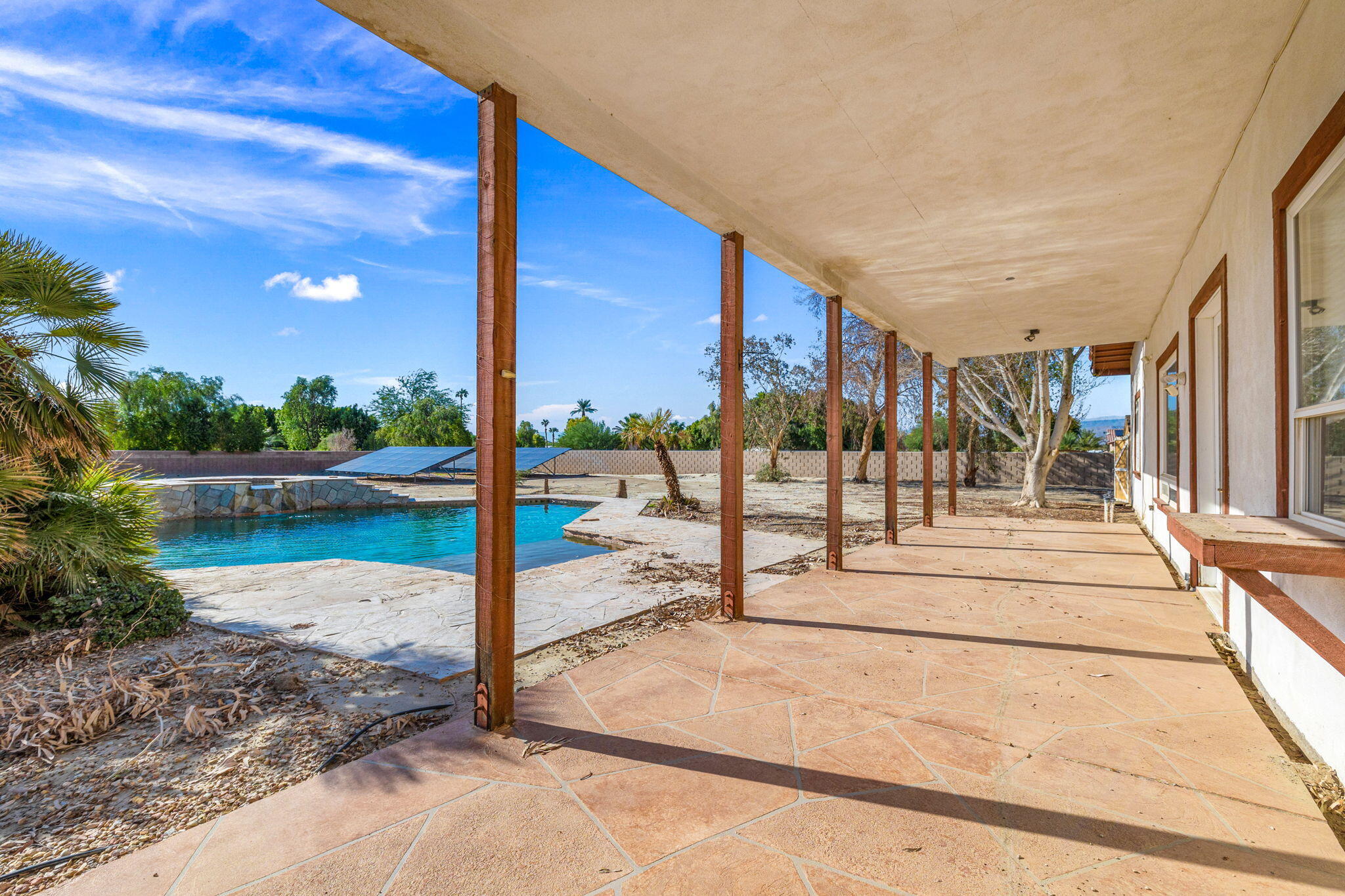 48755 Southview Place Indio, CA 92201 - Photo 12 of 55 a view of a swimming pool with a patio