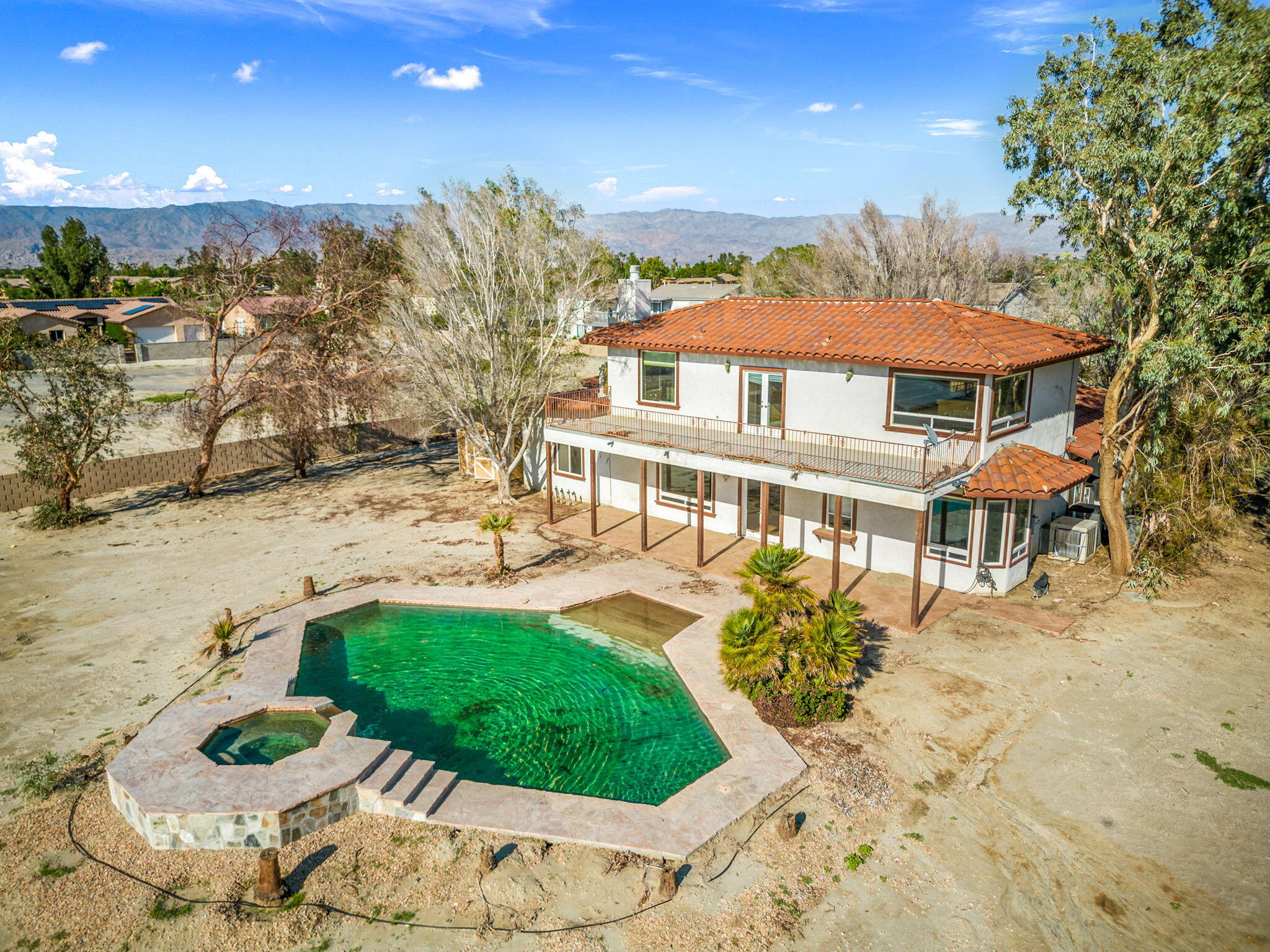 48755 Southview Place Indio, CA 92201 - Photo 2 of 55 a view of a house with swimming pool