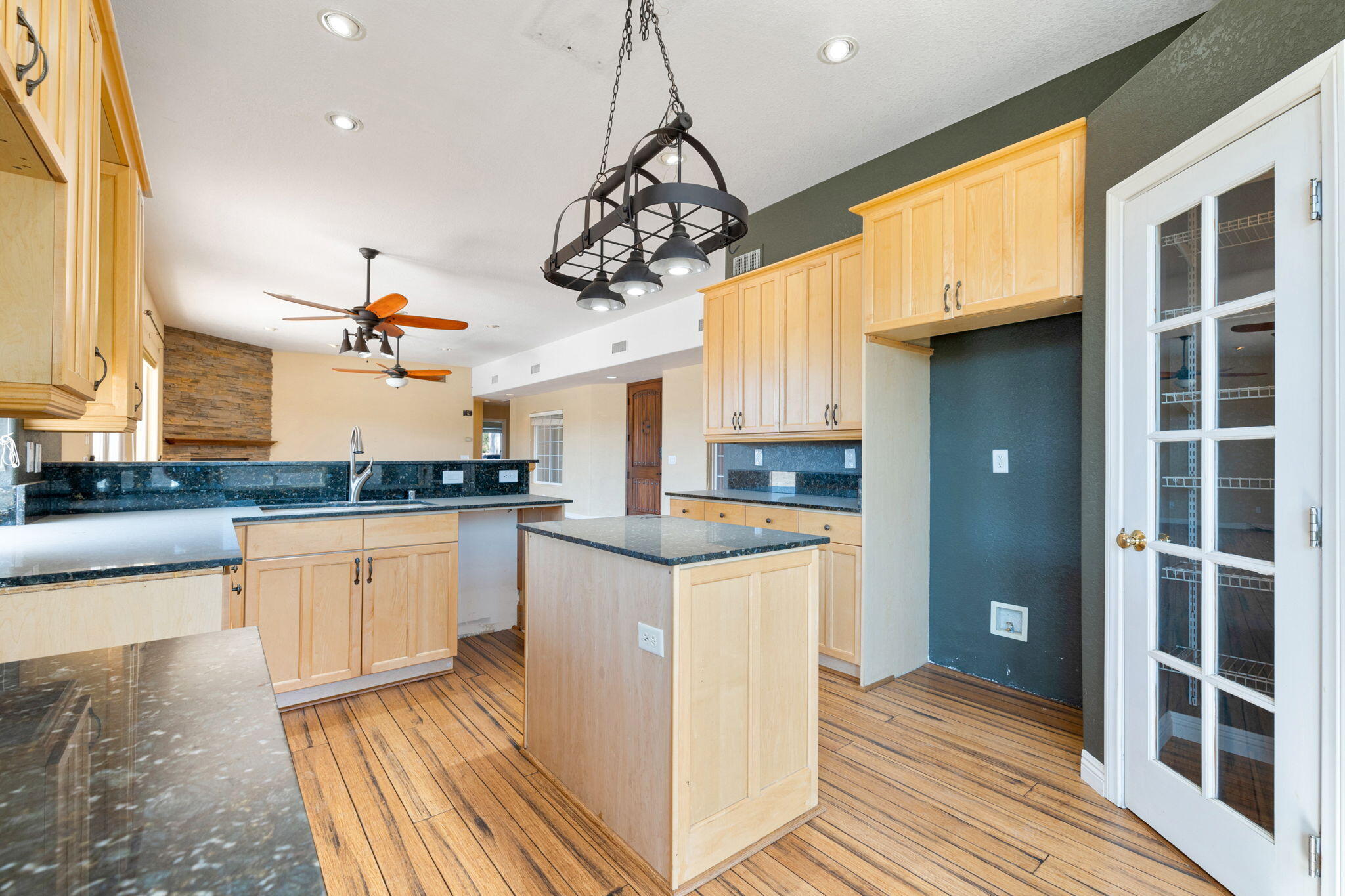48755 Southview Place Indio, CA 92201 - Photo 25 of 55 a kitchen with stainless steel appliances granite countertop a sink and cabinets