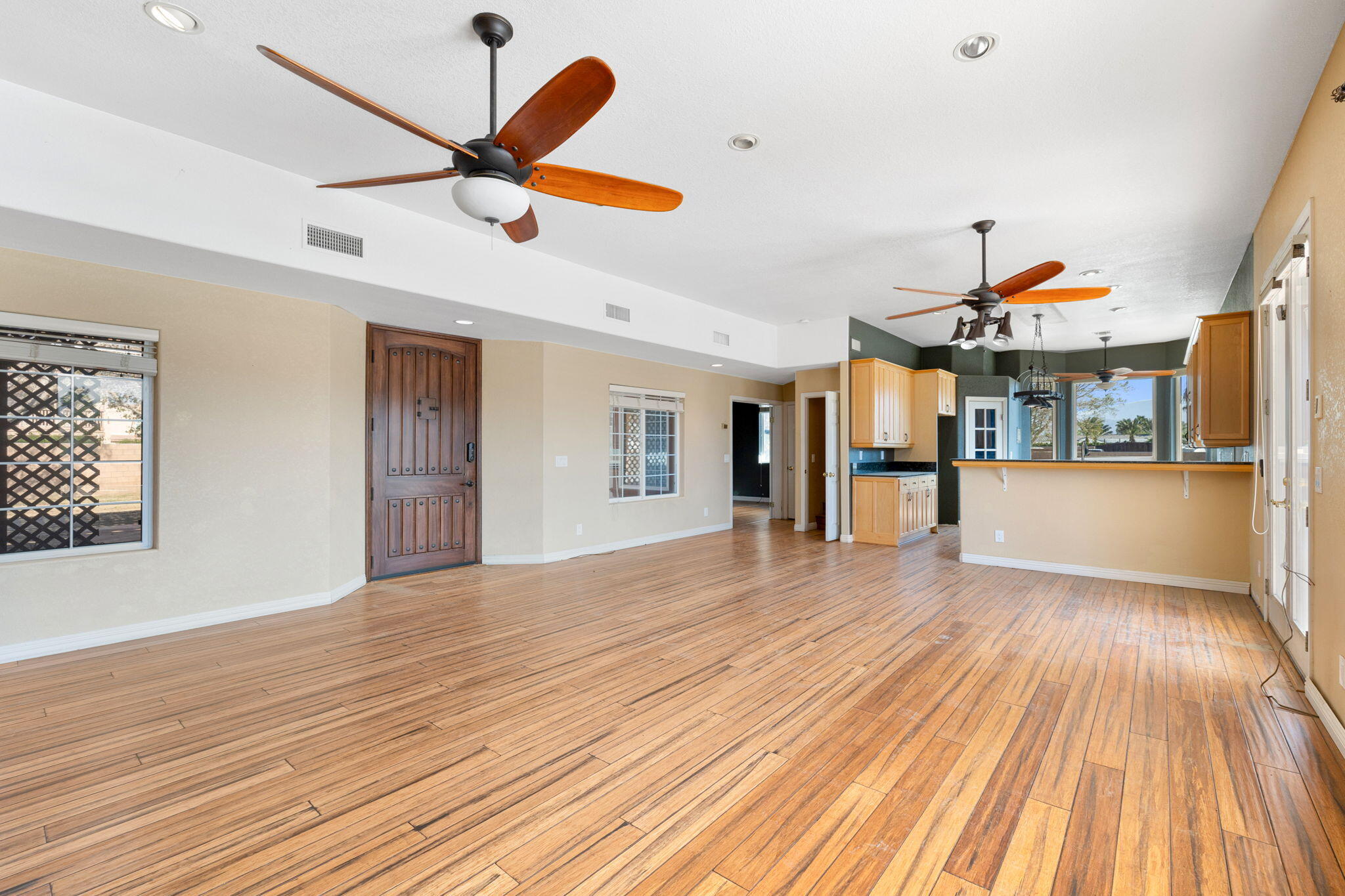 48755 Southview Place Indio, CA 92201 - Photo 30 of 55 a view of a livingroom with wooden floor and a ceiling fan
