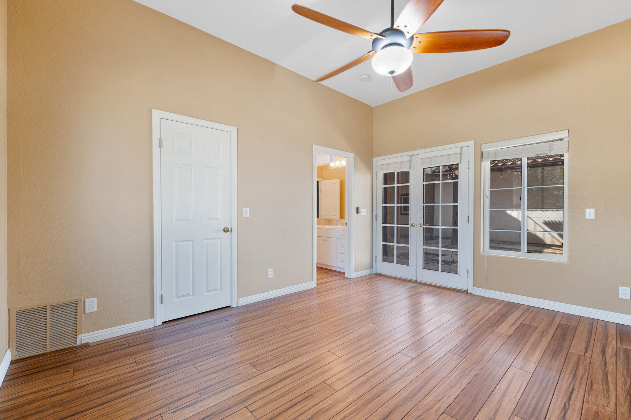 48755 Southview Place Indio, CA 92201 - Photo 39 of 55 wooden floor in an empty room with a window