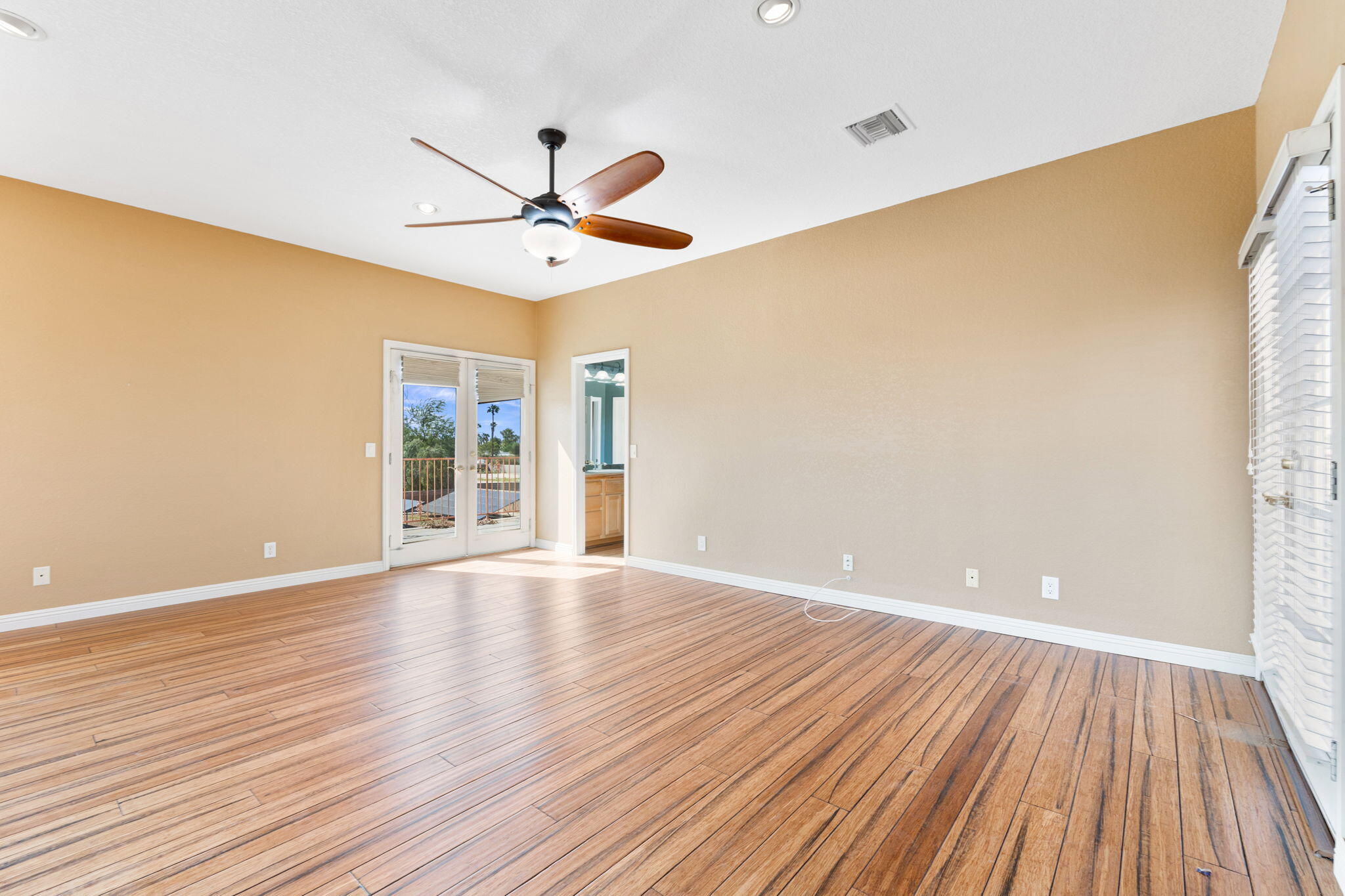 48755 Southview Place Indio, CA 92201 - Photo 45 of 55 a view of an empty room with wooden floor and a window