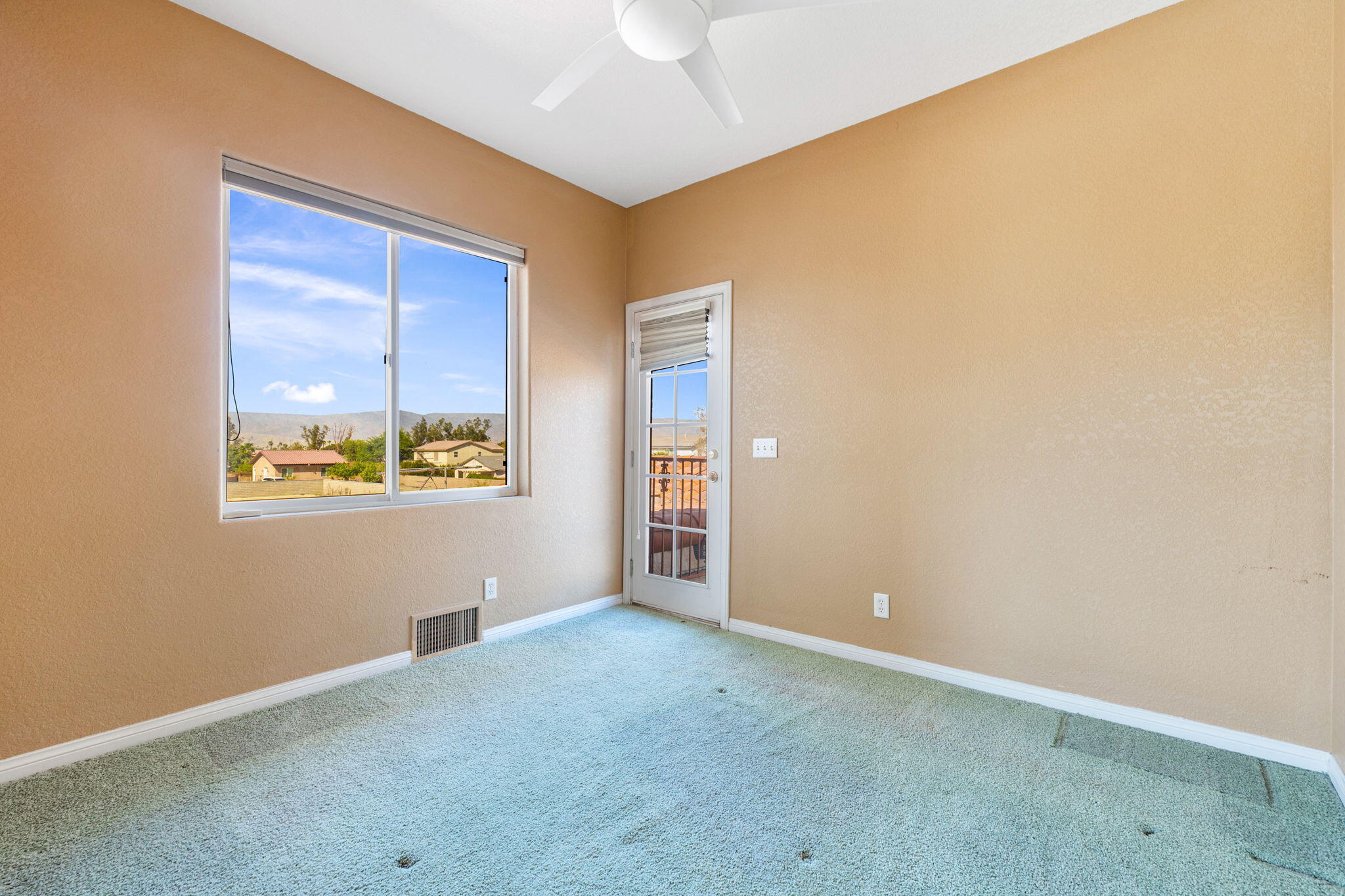 48755 Southview Place Indio, CA 92201 - Photo 55 of 55 an empty room with windows and closet