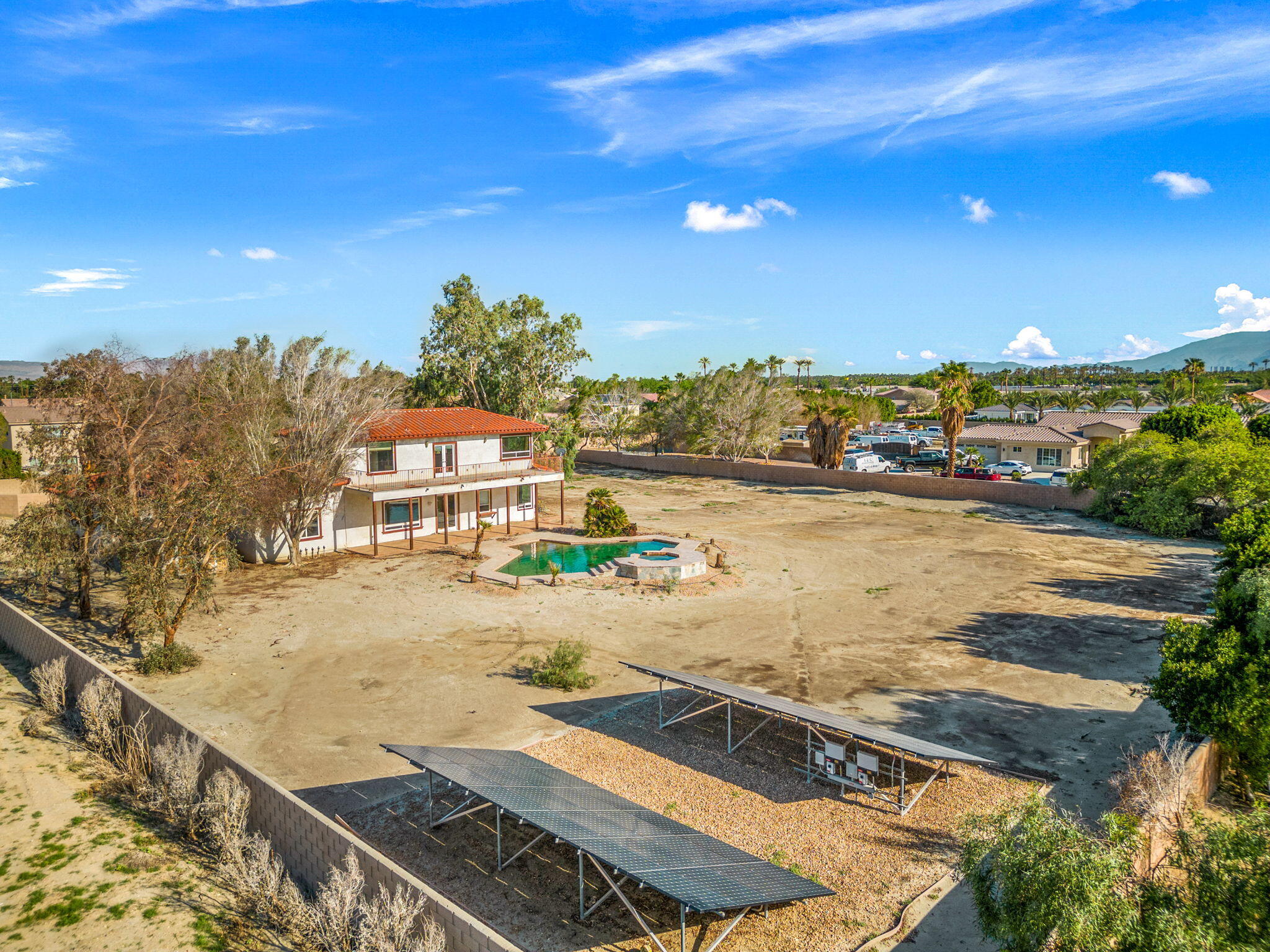 48755 Southview Place Indio, CA 92201 - Photo 7 of 55 a view of a swimming pool with an ocean view