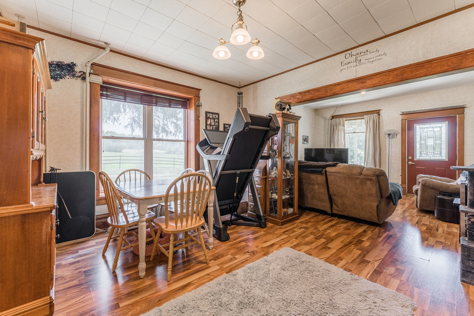 12757 Base Line Road Genoa, IL 60135 - Photo 12 of 49 a living room with furniture a wooden floor and a window
