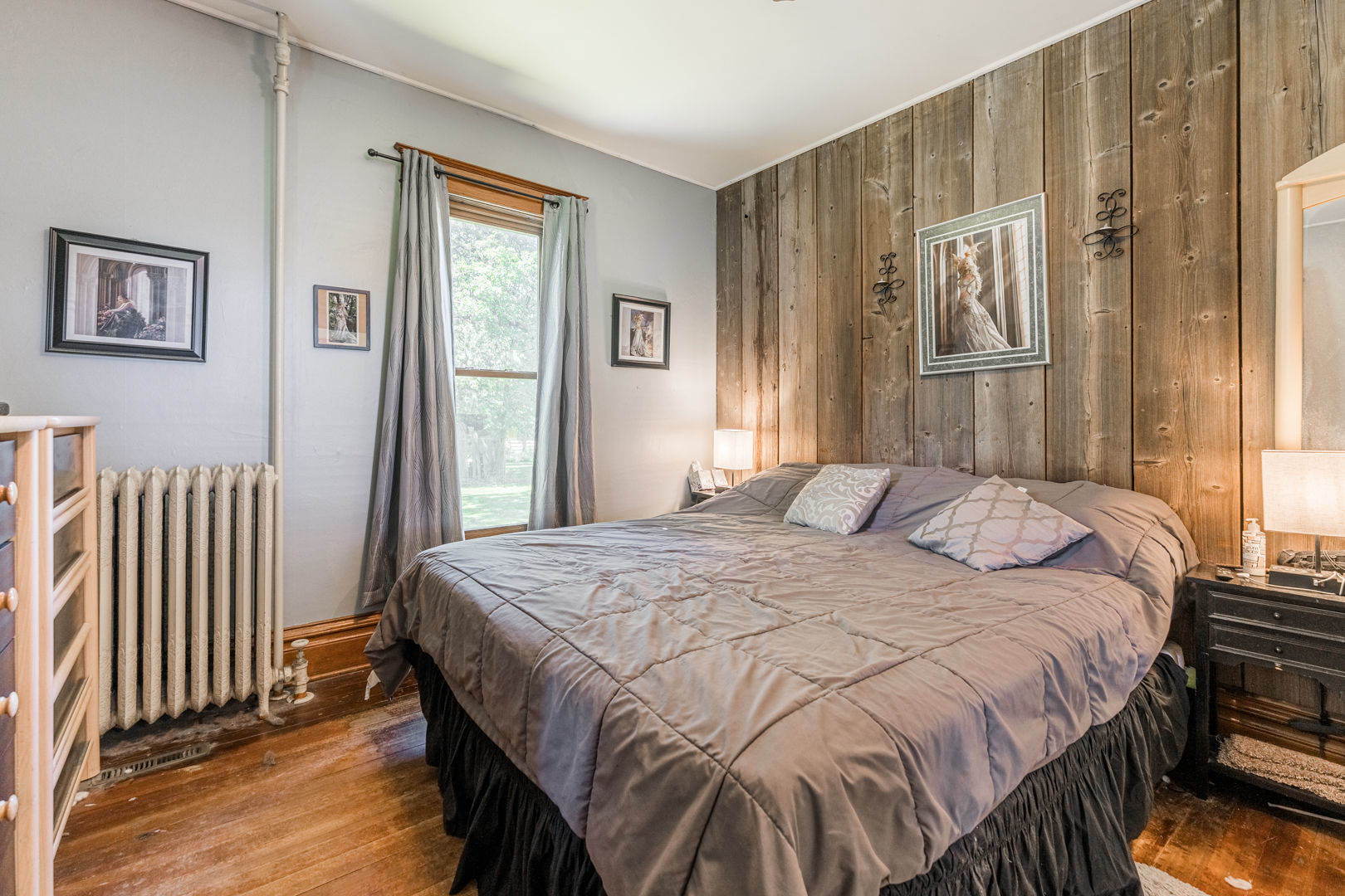 12757 Base Line Road Genoa, IL 60135 - Photo 13 of 49 a bedroom with a bed and wooden floor