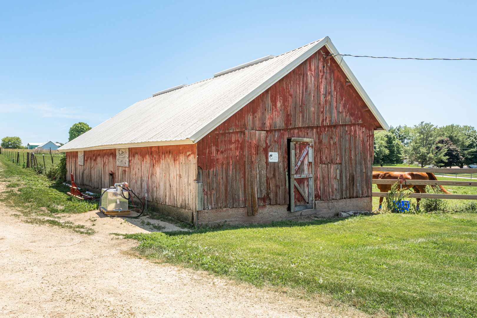 12757 Base Line Road Genoa, IL 60135 - Photo 43 of 49 a view of a backyard with wooden fence