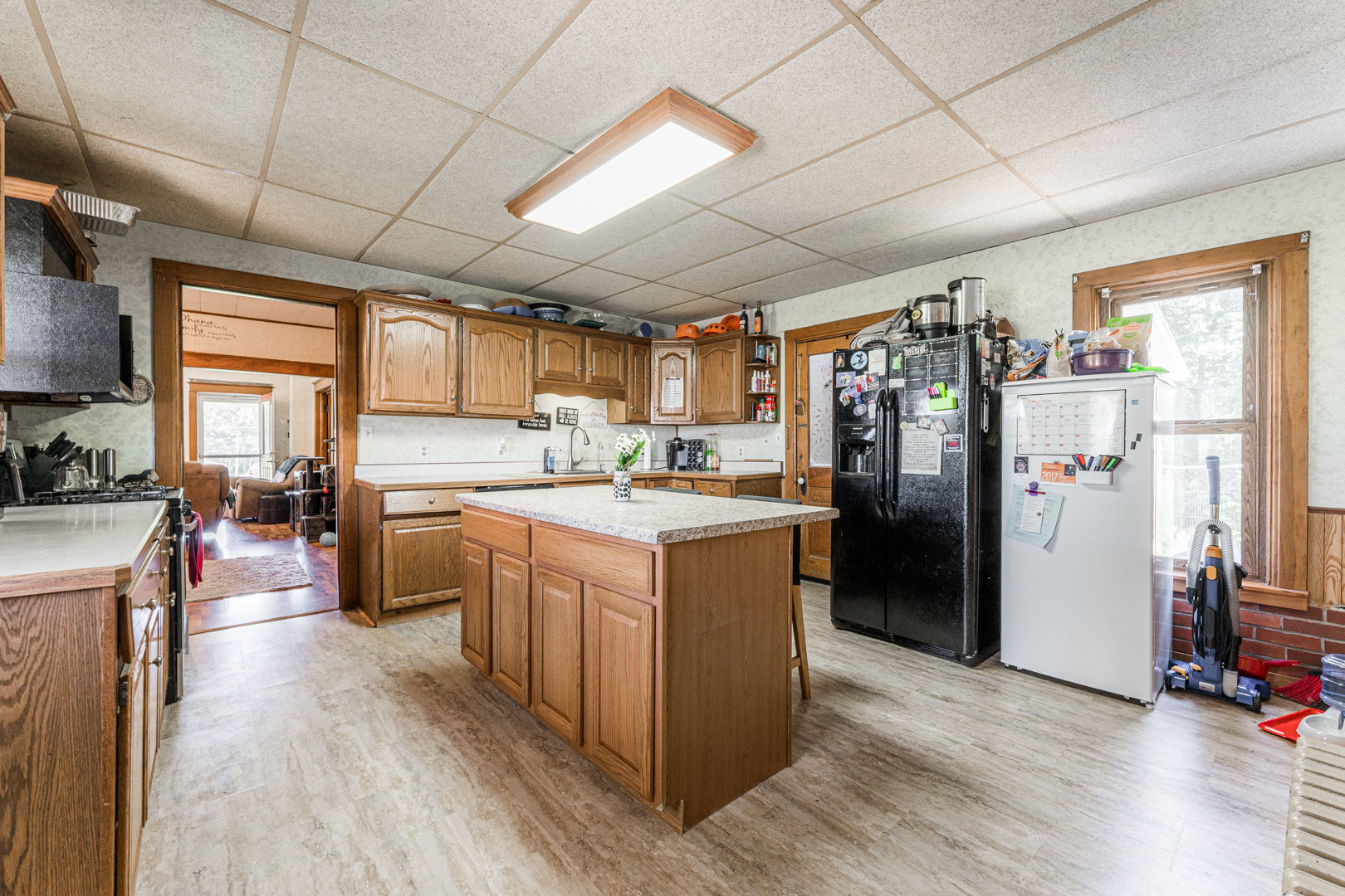 12757 Base Line Road Genoa, IL 60135 - Photo 8 of 49 a kitchen with refrigerator and cabinets