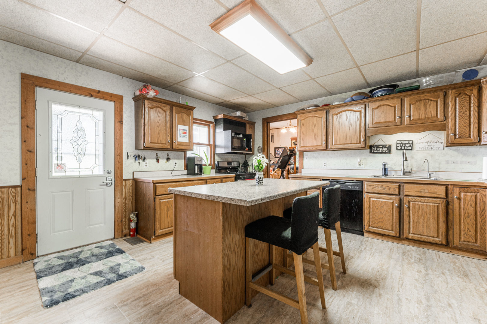 12757 Base Line Road Genoa, IL 60135 - Photo 9 of 49 a kitchen with a sink cabinets and window