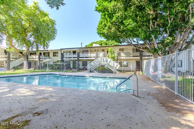 a view of house with a swimming pool