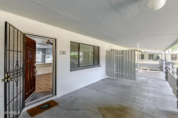 a view of an empty room and bathroom