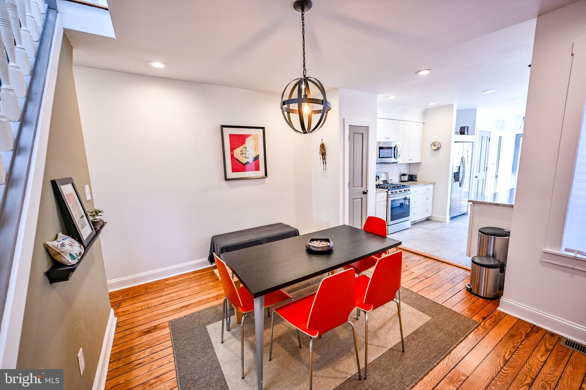 2939 Keswick Road Baltimore, MD 21211 - Photo 11 of 55 Dining room w/ heart pine flooring
