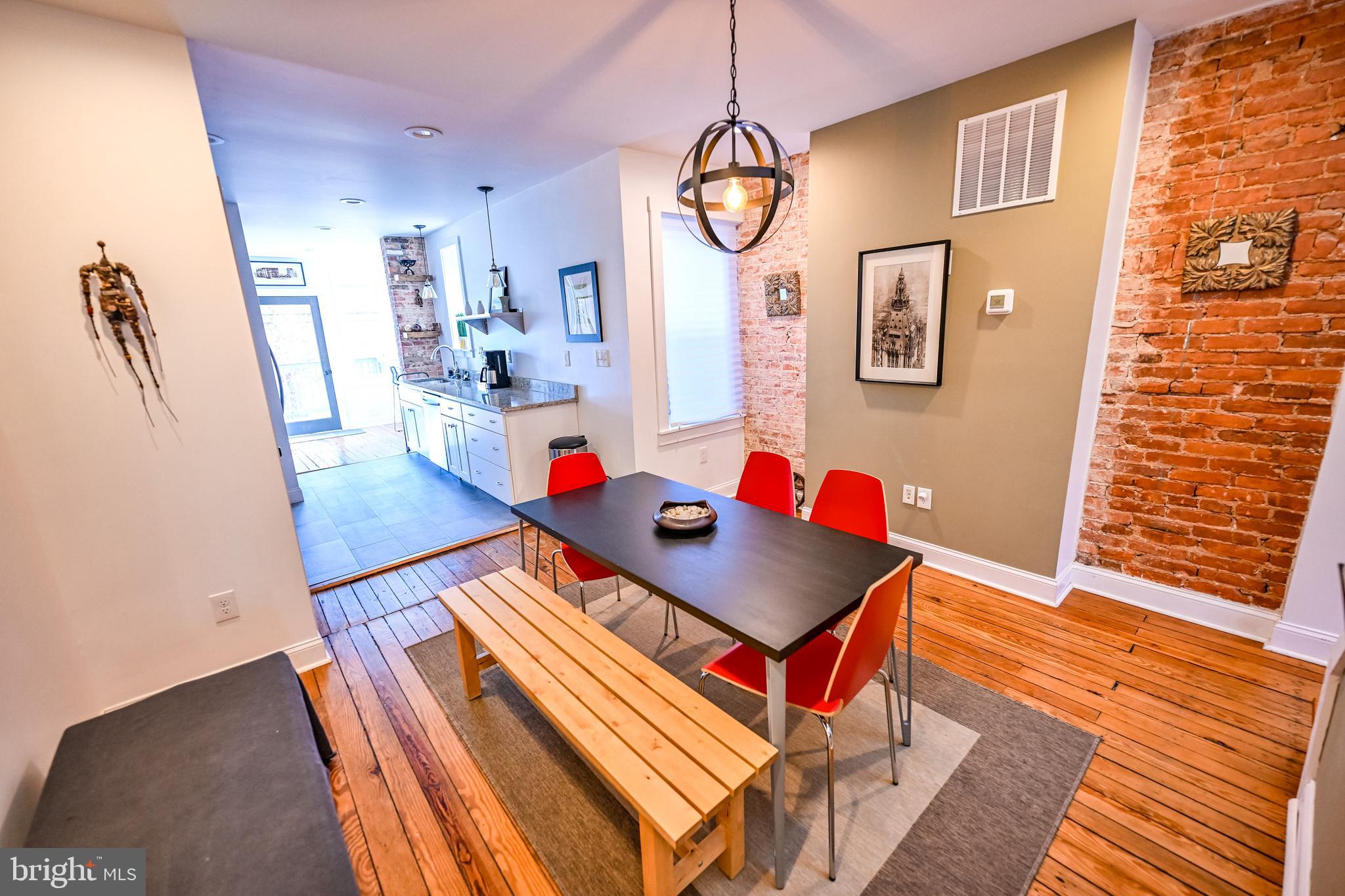 2939 Keswick Road Baltimore, MD 21211 - Photo 13 of 55 Dining room w/ heart pine flooring