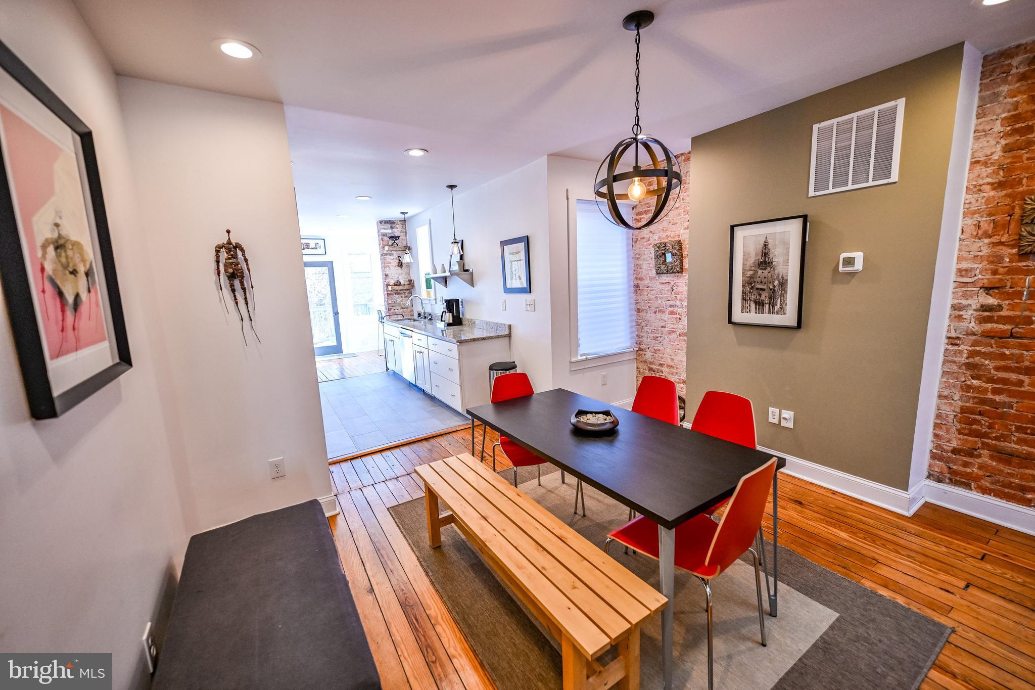2939 Keswick Road Baltimore, MD 21211 - Photo 10 of 55 Dining room w/ heart pine flooring