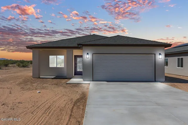 a view of backyard of a house