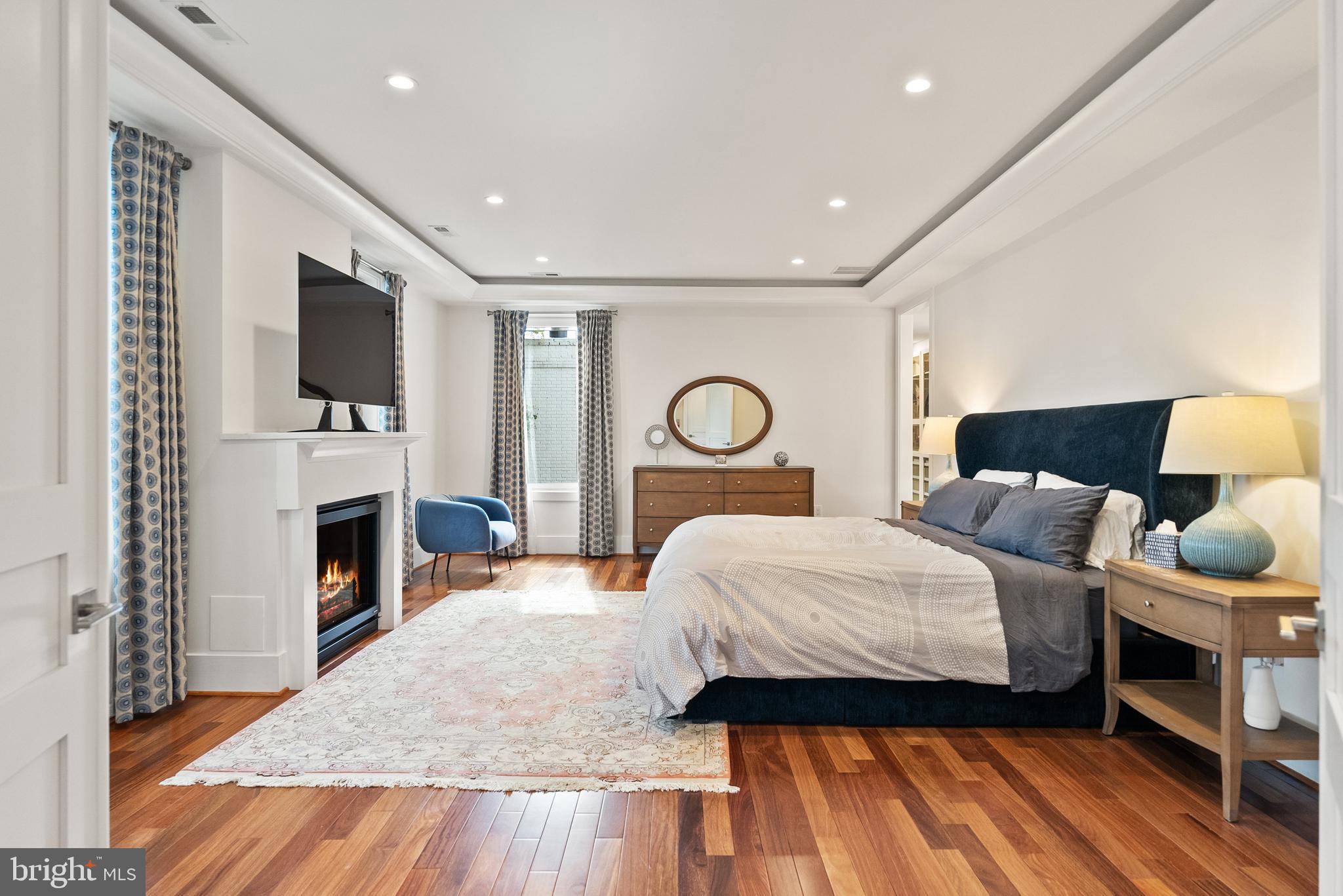 5152 Linnean Terrace Northwest Washington, DC 20008 - Photo 15 of 39 a bedroom with a bed and a flat screen tv