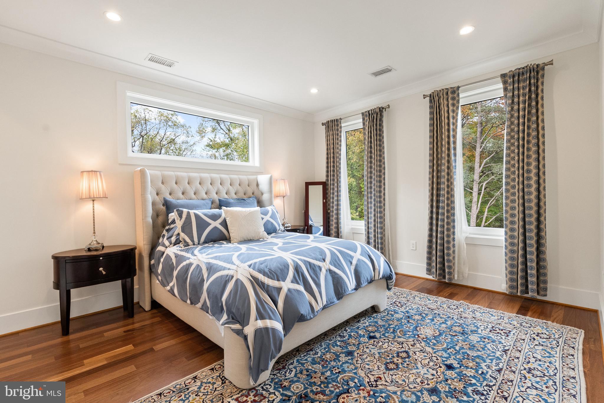 5152 Linnean Terrace Northwest Washington, DC 20008 - Photo 18 of 39 a bedroom with a bed lamp and window