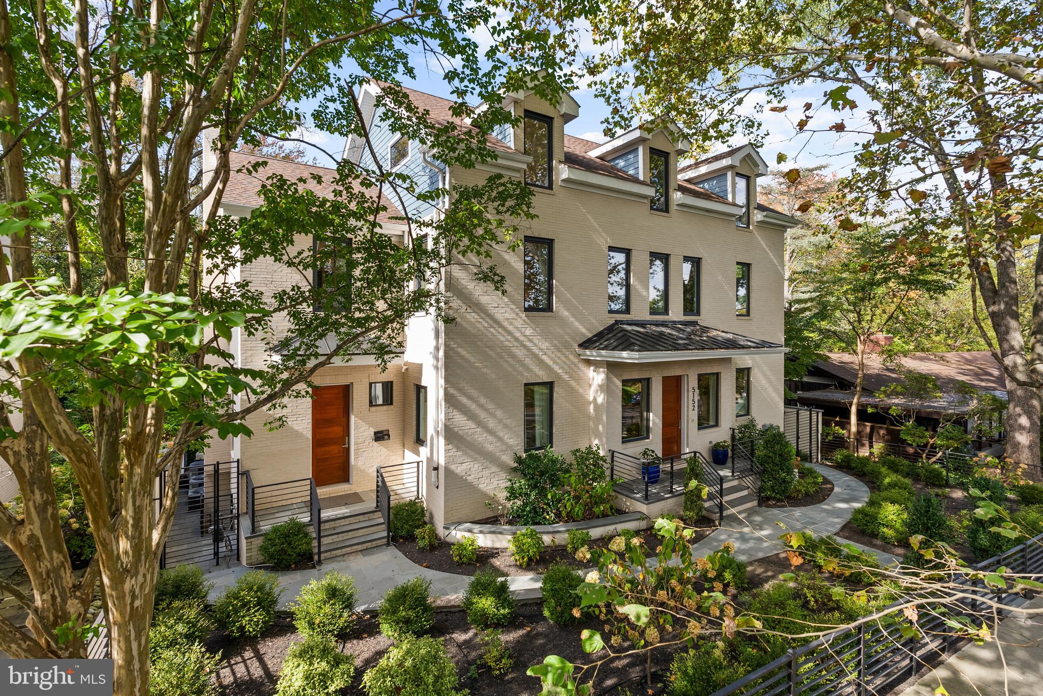 5152 Linnean Terrace Northwest Washington, DC 20008 - Photo 2 of 39 a front view of a house with a yard