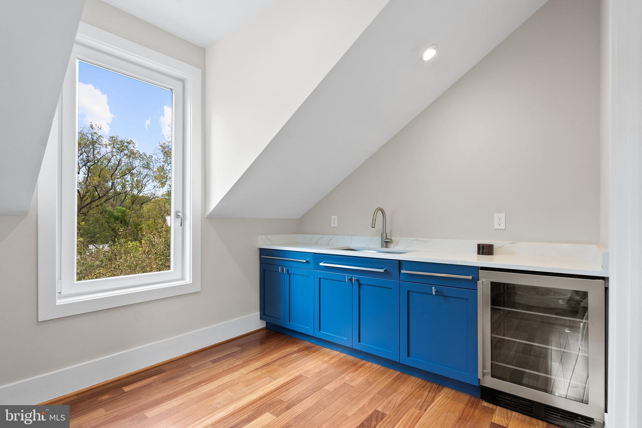 5152 Linnean Terrace Northwest Washington, DC 20008 - Photo 26 of 39 a kitchen with wooden cabinets and sink