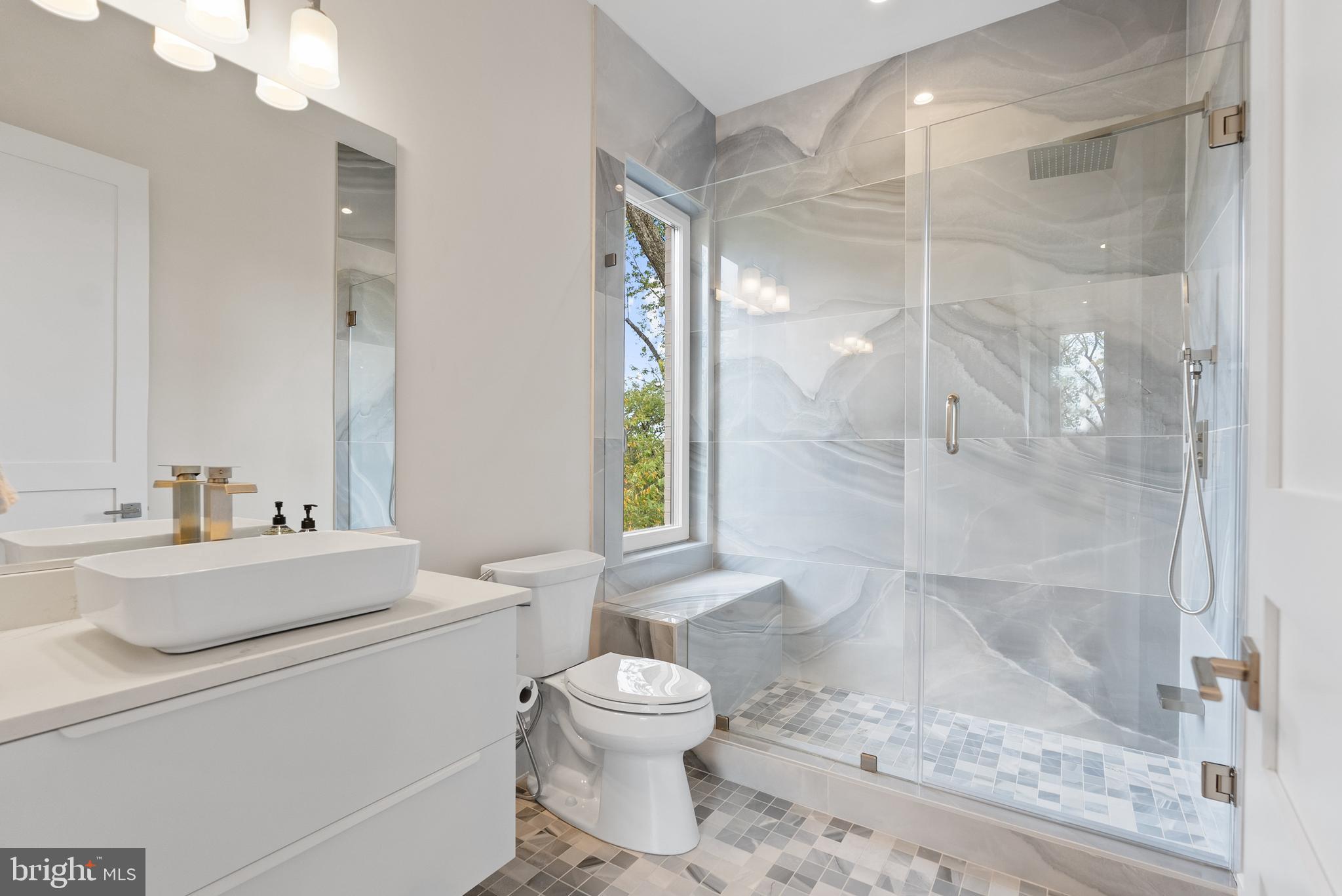5152 Linnean Terrace Northwest Washington, DC 20008 - Photo 27 of 39 a bathroom with a sink toilet and shower