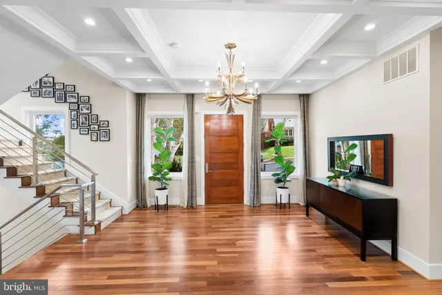 a open kitchen with lots of counter space a sink appliances and dining table