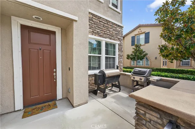 a view of a house with outdoor sitting space