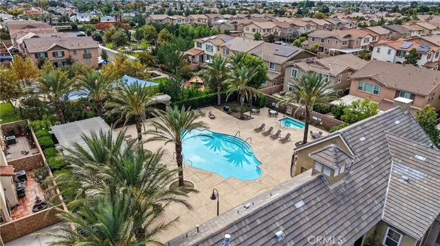 an aerial view of residential house with outdoor space and swimming pool