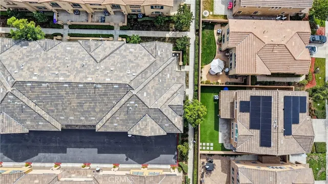 a aerial view of a house with large trees