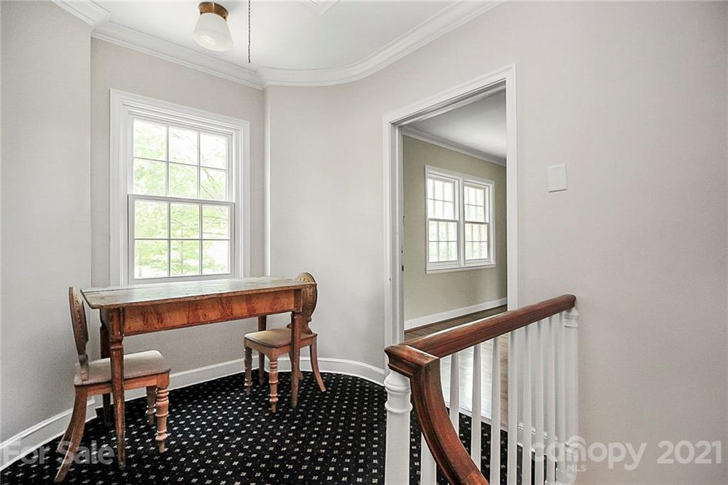 930 Ardsley Road, Unit B4 Charlotte, NC 28207 - Photo 11 of 35 a view of a room with furniture window and wooden floor