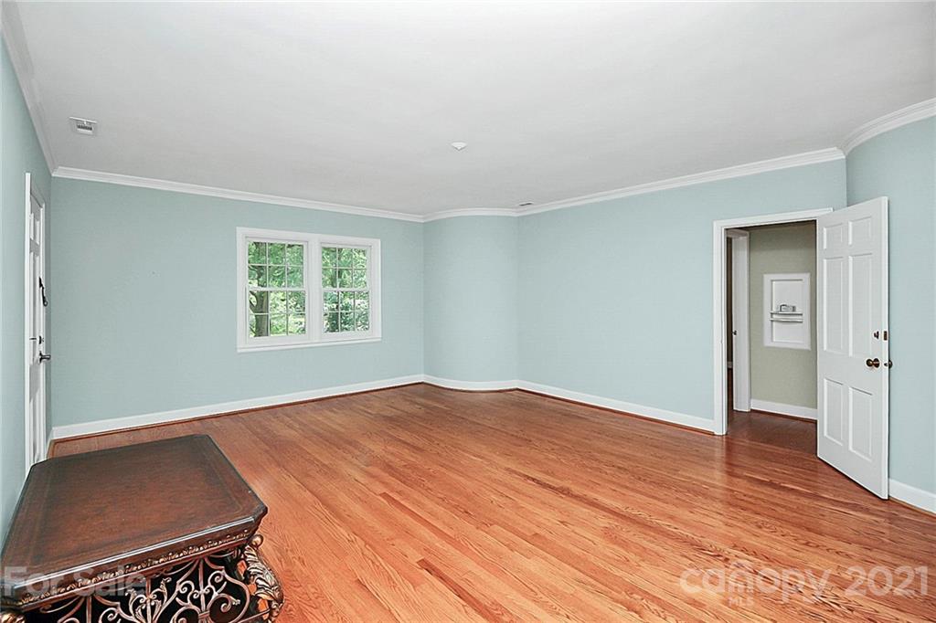930 Ardsley Road, Unit B4 Charlotte, NC 28207 - Photo 15 of 35 an empty room with wooden floor closet and windows
