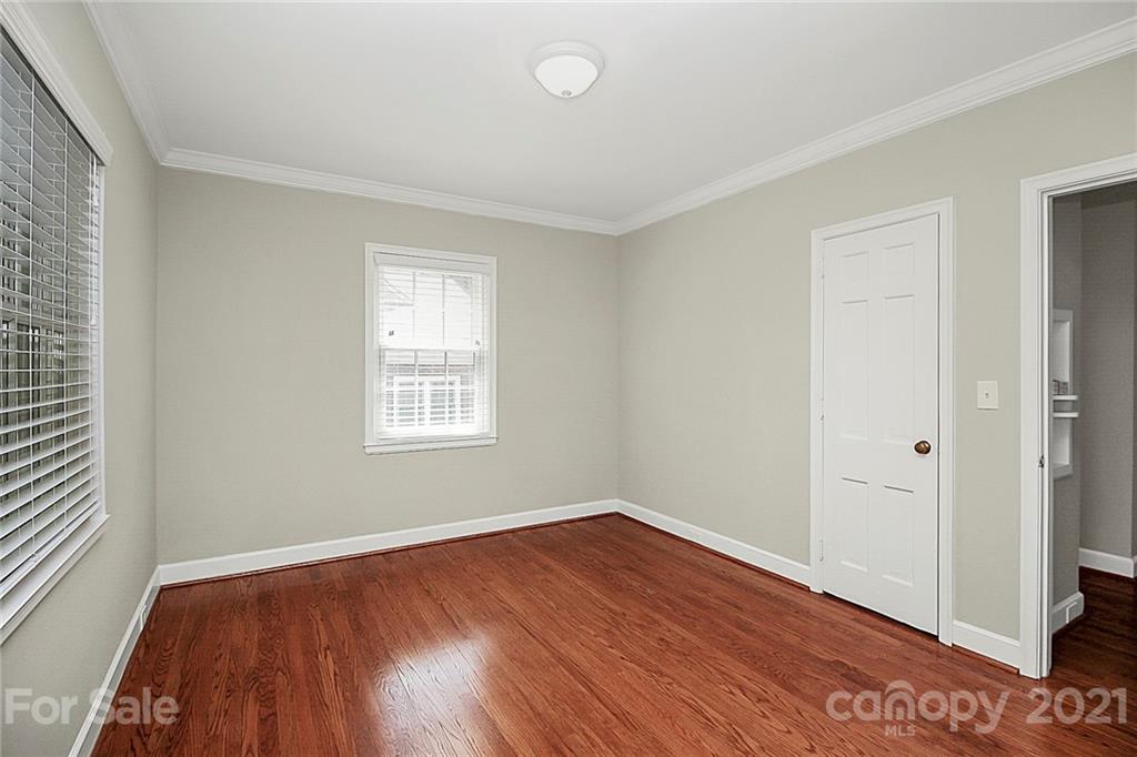 930 Ardsley Road, Unit B4 Charlotte, NC 28207 - Photo 27 of 35 wooden floor in an empty room with a window