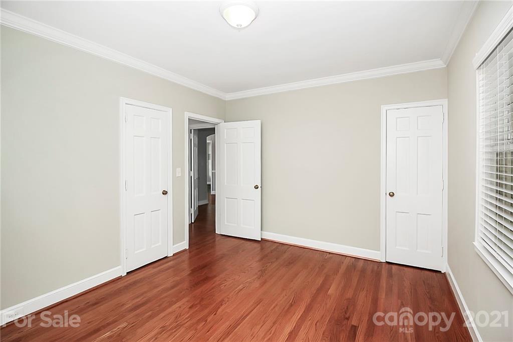 930 Ardsley Road, Unit B4 Charlotte, NC 28207 - Photo 28 of 35 an empty room with wooden floor
