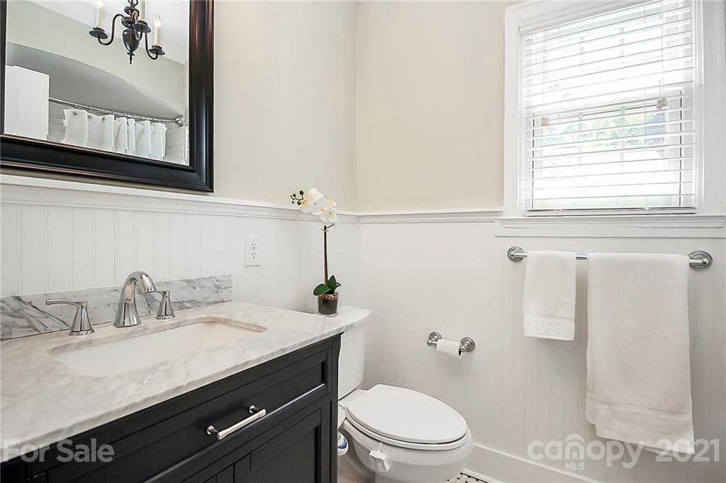 930 Ardsley Road, Unit B4 Charlotte, NC 28207 - Photo 29 of 35 a bathroom with a granite countertop sink toilet and shower