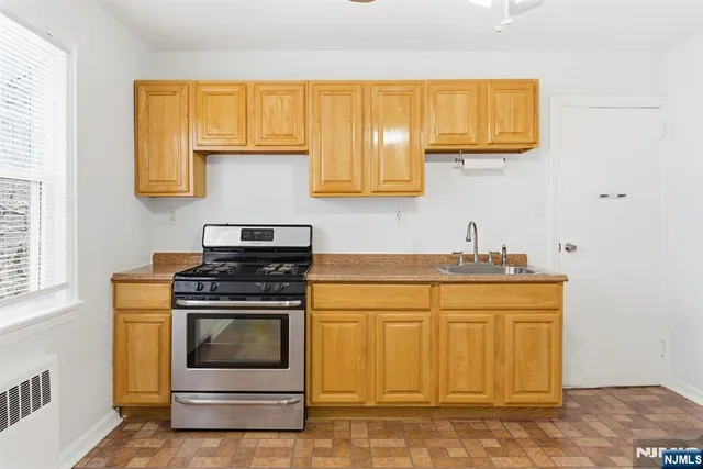 a kitchen with a stove and a sink