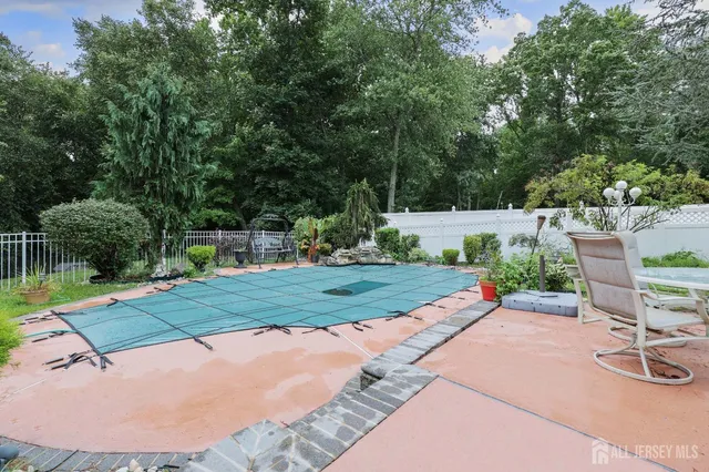 a view of a backyard with sitting area
