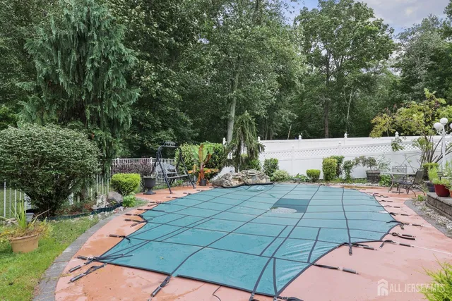 a view of a backyard with sitting area