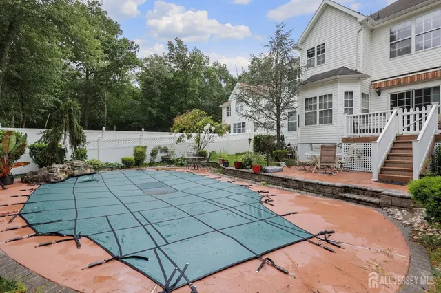 a view of a patio with swimming pool