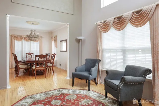 a dining room with furniture and wooden floor