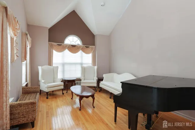 a living room with furniture a fireplace and a table