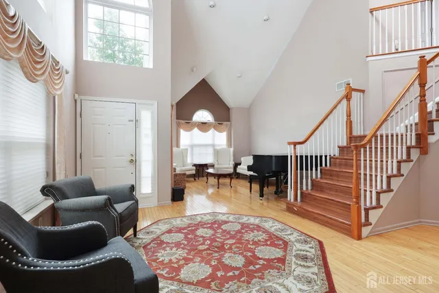 a living room with furniture and a rug