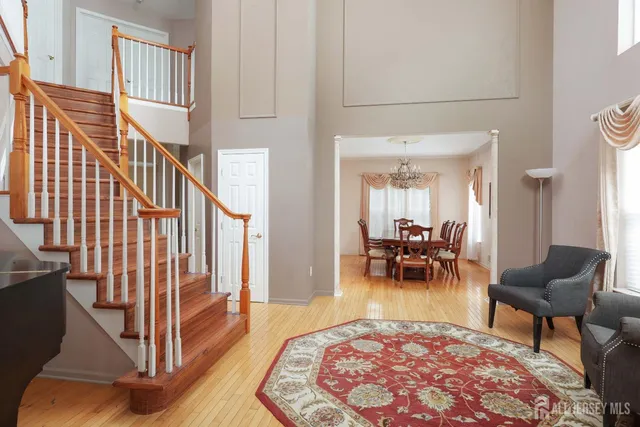 a living room with furniture and a dining table