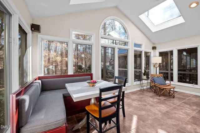 a kitchen with stainless steel appliances granite countertop a stove and a wooden floors