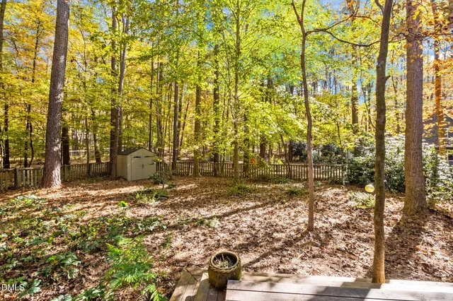 a living room with furniture and a book shelf
