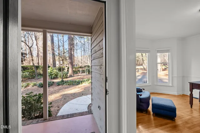 a aerial view of a house with a yard and balcony